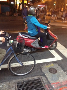 Taipei scooter rider with yoga mat